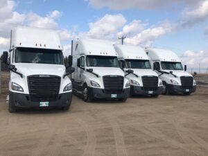 four white trucks